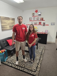 two fish employees posing