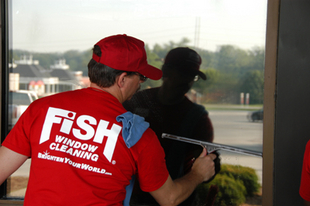 Exterior Cleaners Okemos  Fish Window Cleaning Lansing Cleaner Using Squeegee on Exterior Window