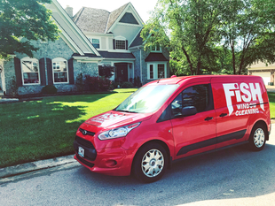 Fish Window Cleaning Van in Front of Home