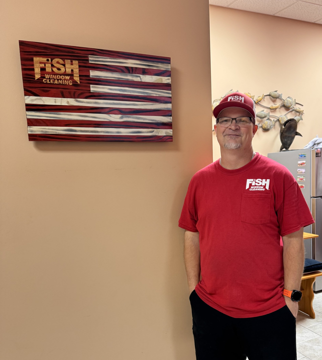 man in FISH red standing