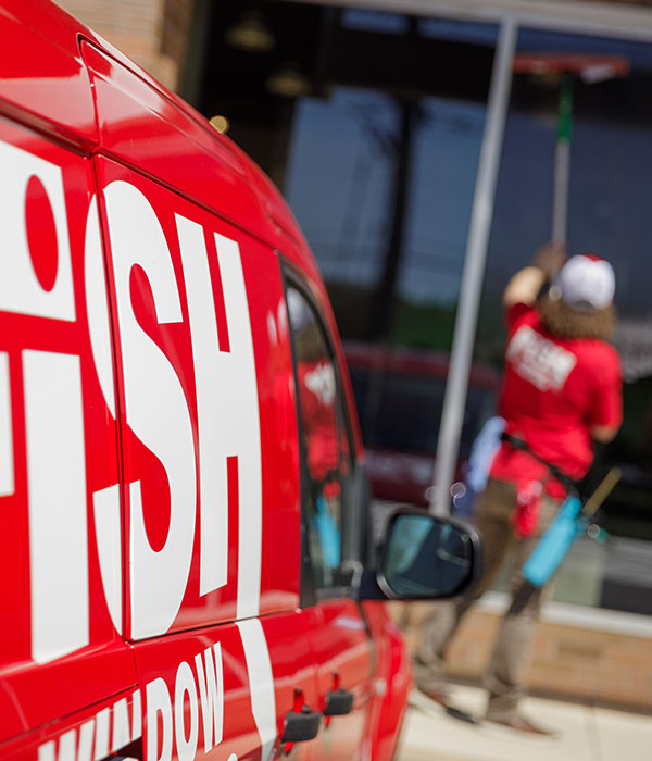 van that says 'fish window cleaning' on it