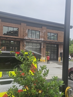 window cleaner cleaning window of new fire department